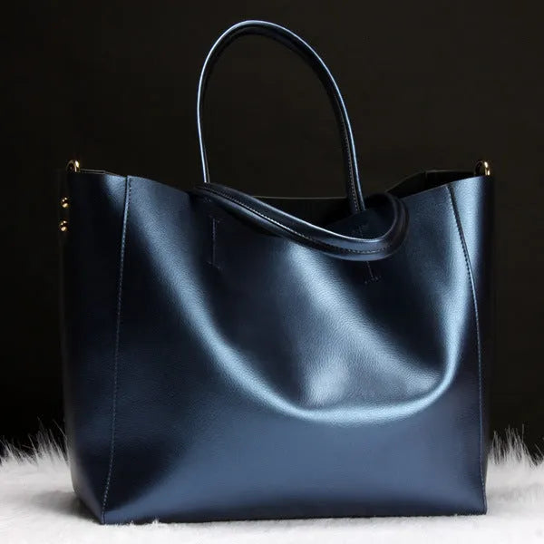 Women's structured cowhide leather shoulder bag shown in silver, with detachable strap.