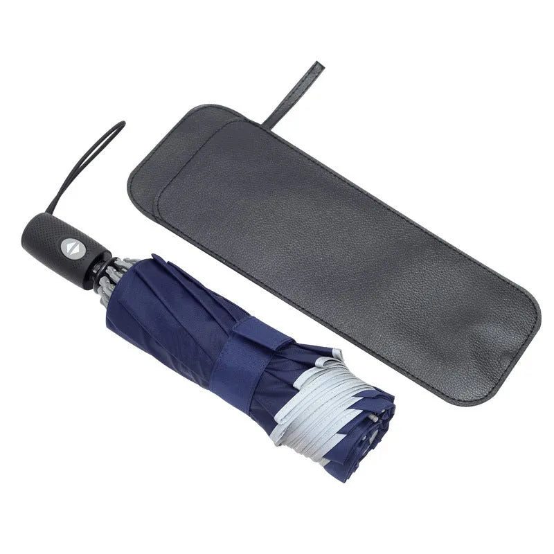 Black automatic reverse umbrella shown open, showcasing its 10-bone frame and folded compact size.