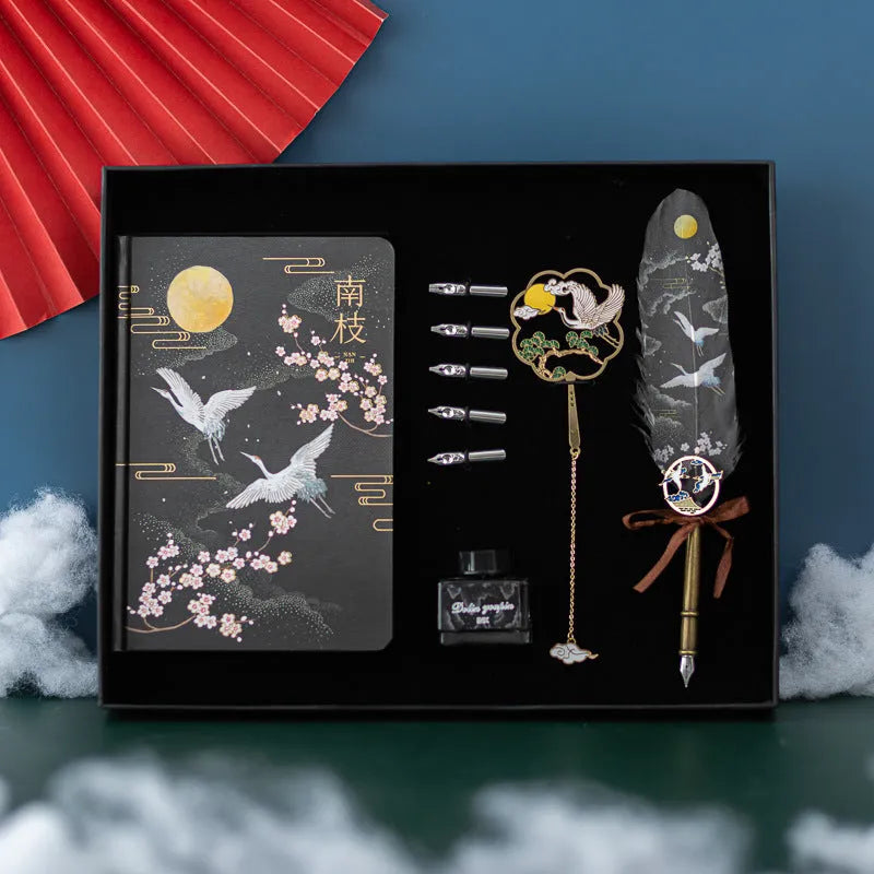 Chinese feather pen calligraphy set with metal sheath, 36 pens, and Jianhegui notebook in gift box.