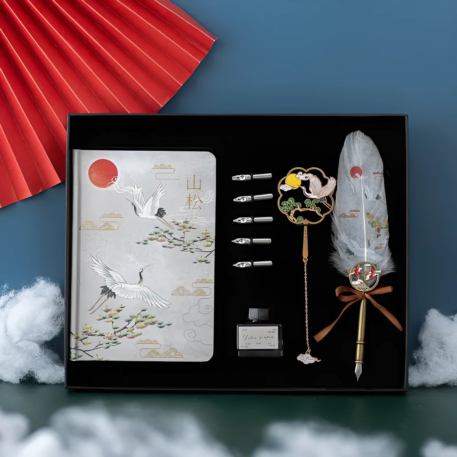 Chinese feather pen calligraphy set with metal sheath, 36 pens, and Jianhegui notebook in gift box.