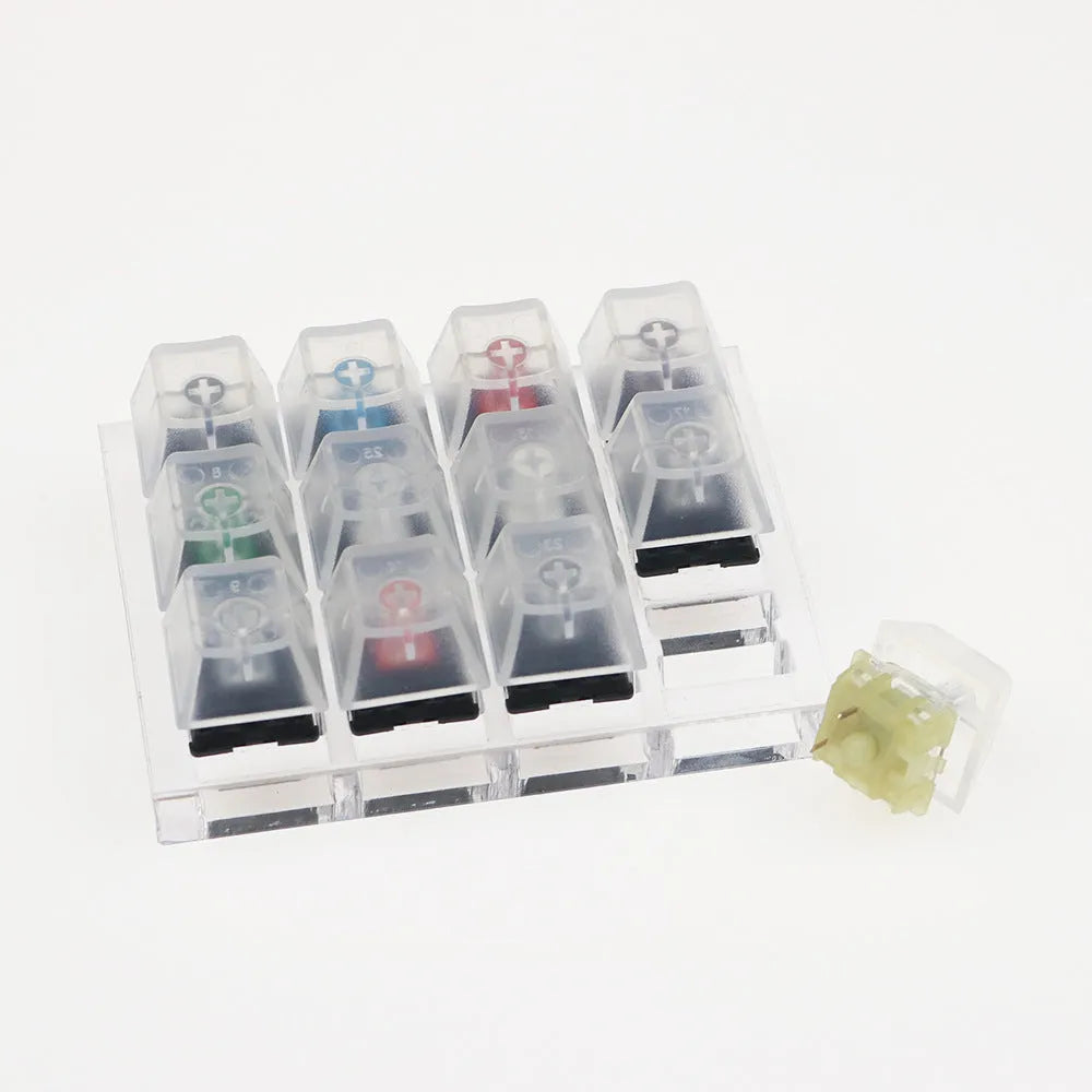 Cherry Original Twelve-Axis Tester showing twelve different MX switches in a plastic housing, available in black green and white