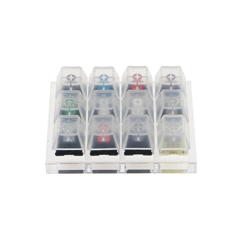 Cherry Original Twelve-Axis Tester showing twelve different MX switches in a plastic housing, available in black green and white
