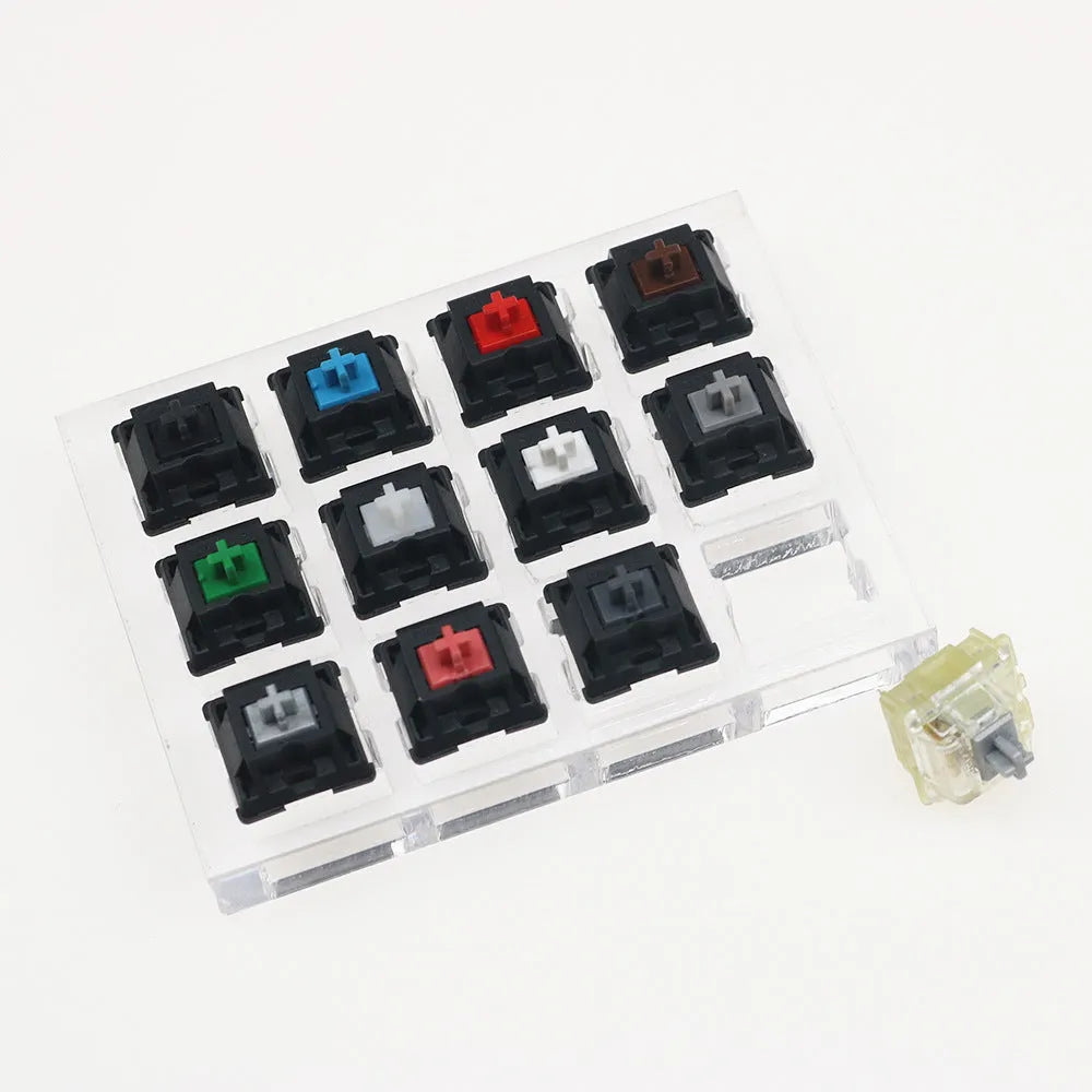 Cherry Original Twelve-Axis Tester showing twelve different MX switches in a plastic housing, available in black green and white