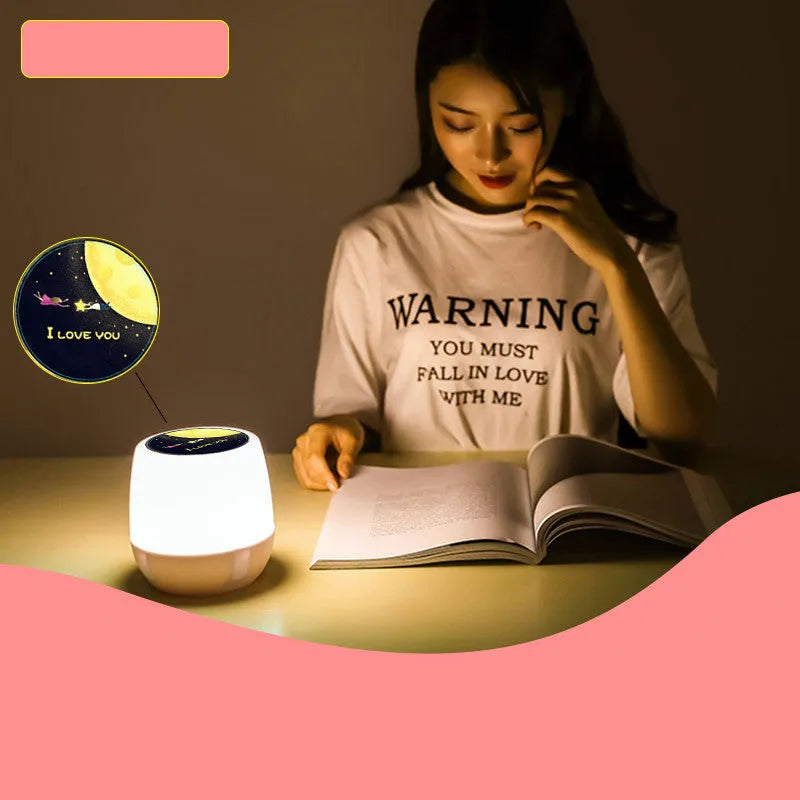 Pruixin PRX1363 rotating projector night light showing star and moon pattern on wall.
