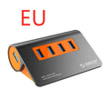 Dark grey USB hub with four ports and orange accents, showing aluminium construction and separate data cable