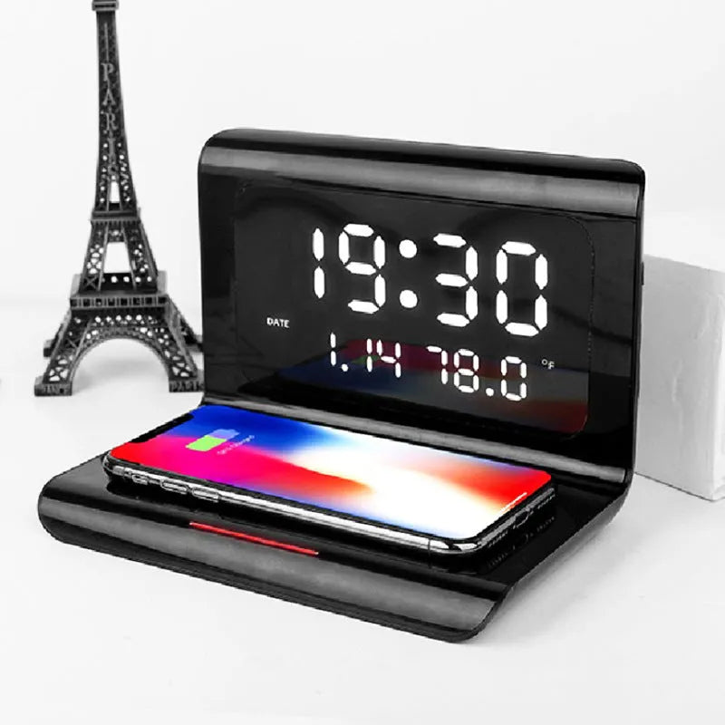 N1 model wireless charging alarm clock showing time, date and temperature display with phone charging on surface