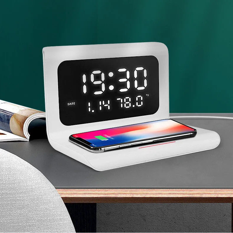 N1 model wireless charging alarm clock showing time, date and temperature display with phone charging on surface