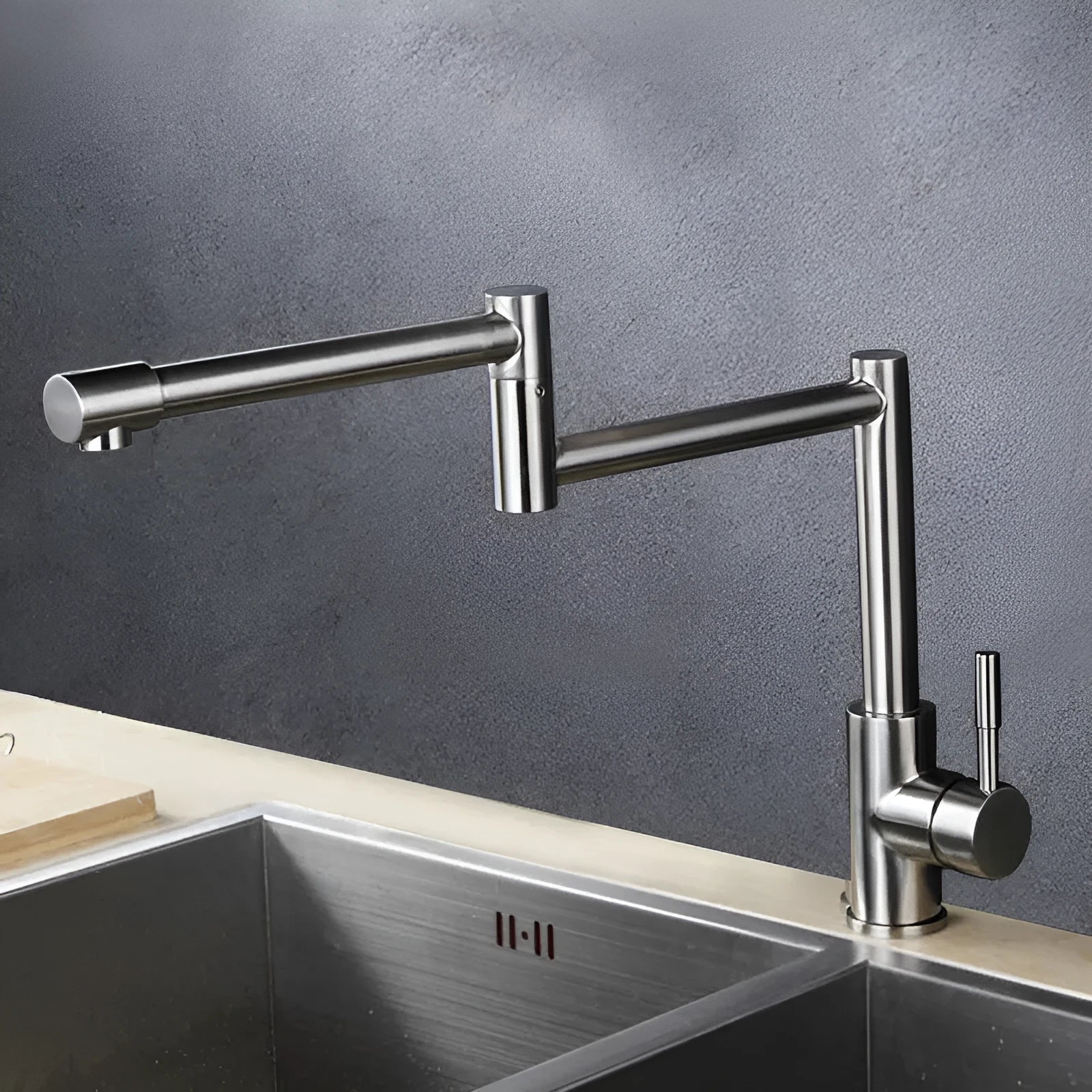 Silver stainless steel kitchen mixer tap with 360-degree rotating spout