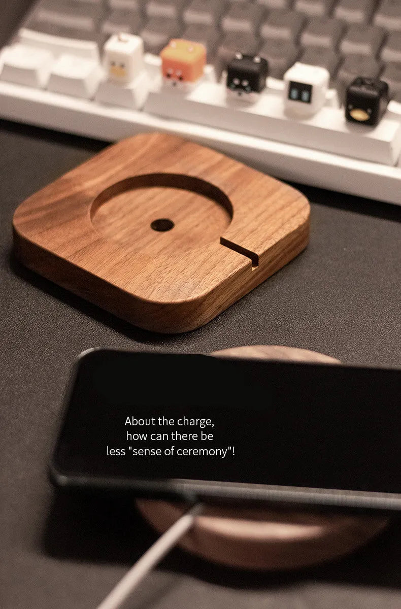 Walnut wood magnetic wireless charger bracket on desk with smartphone