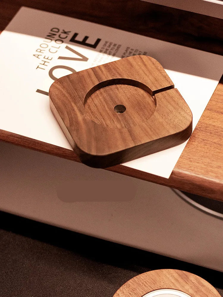 Walnut wood magnetic wireless charger bracket on desk with smartphone