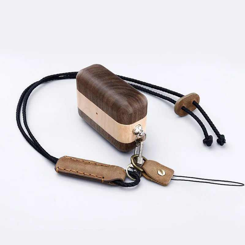 Solid wooden hard shell protective case for Bluetooth earphones with optional neck lanyard.