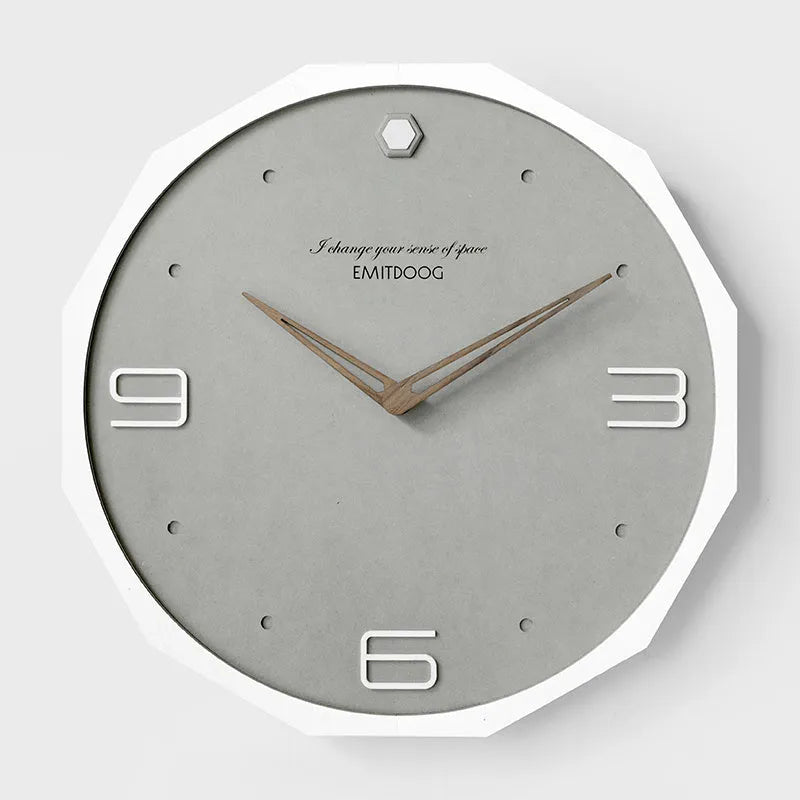 12 inch round Nordic wall clock with perforated face and wooden frame in choice of four finishes