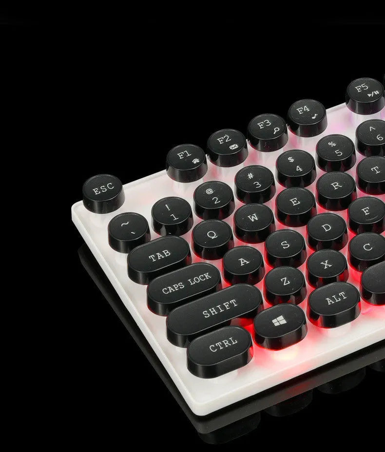 Limei Tx30 retro punk keyboard with rainbow backlight and round key caps, black colour, on a desk