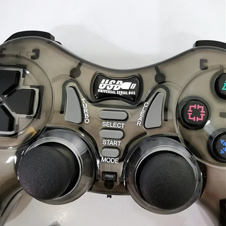 Red and grey wireless PC360 game controller with USB receiver on a desk