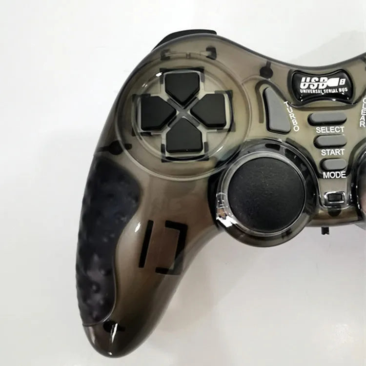 Red and grey wireless PC360 game controller with USB receiver on a desk