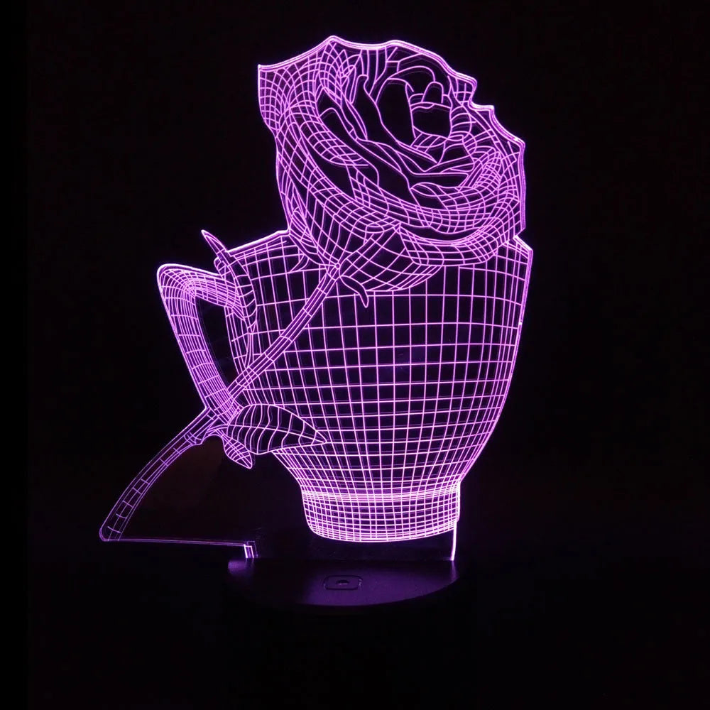 3D acrylic rose flower night light in black finish on a table, showing multicoloured LED illumination.