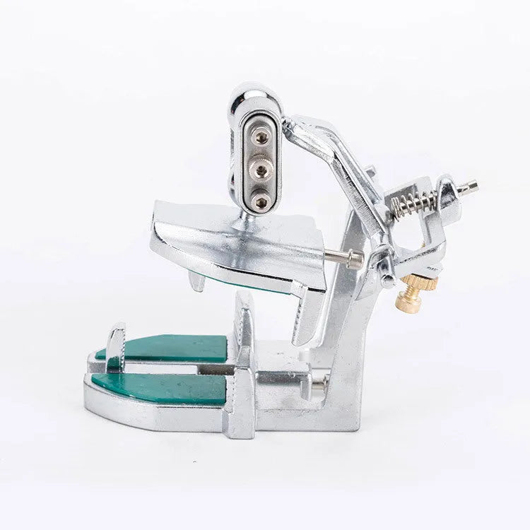 Korean metal dental articulator with adjustable joints for jaw simulation.