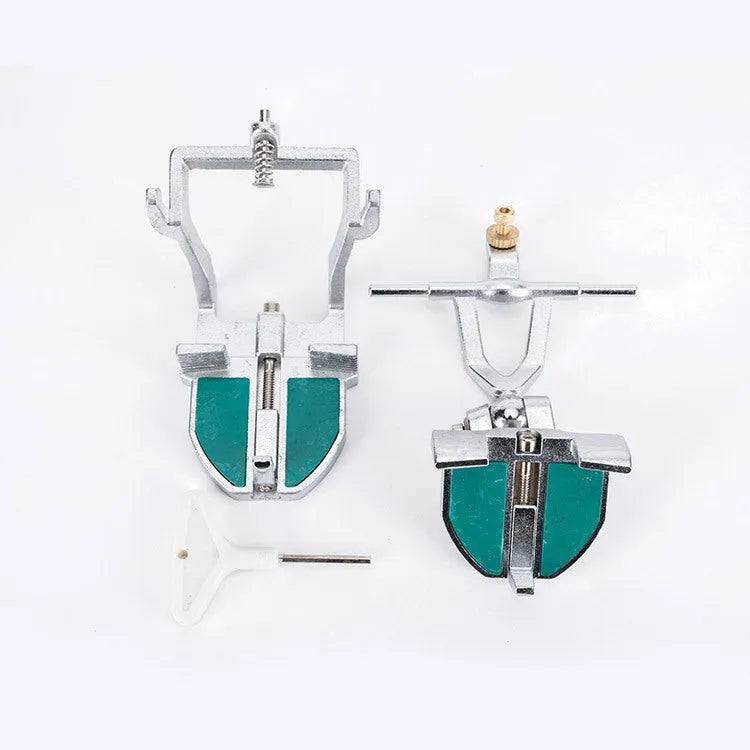 Korean metal dental articulator with adjustable joints for jaw simulation.