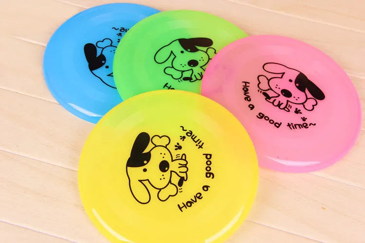 Silicone flying saucer dog toy 20cm diameter in random colour on grass for outdoor fetching play