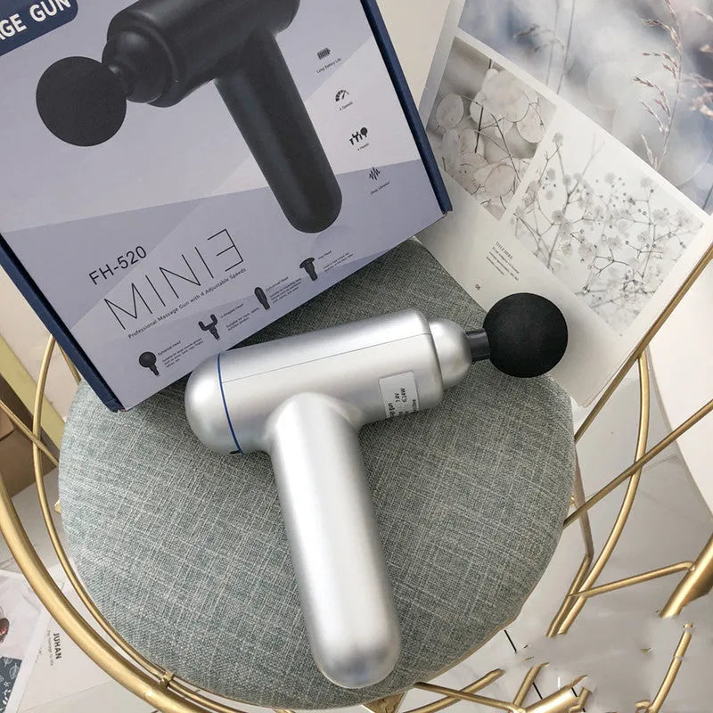 Black fascia gun massager with USB charging port for muscle relaxation