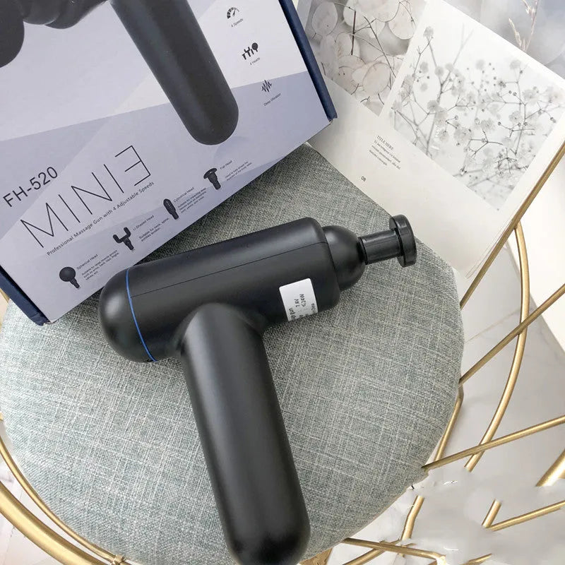 Black fascia gun massager with USB charging port for muscle relaxation