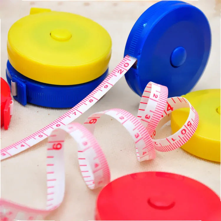 Mini portable plastic measuring tape wound with 150cm metric and city scale, compact 5cm diameter
