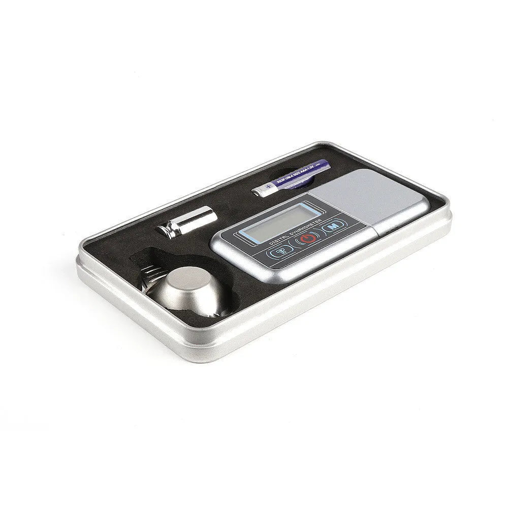 Electronic jewellers scale with digital display showing 0.005g precision and 100g maximum capacity