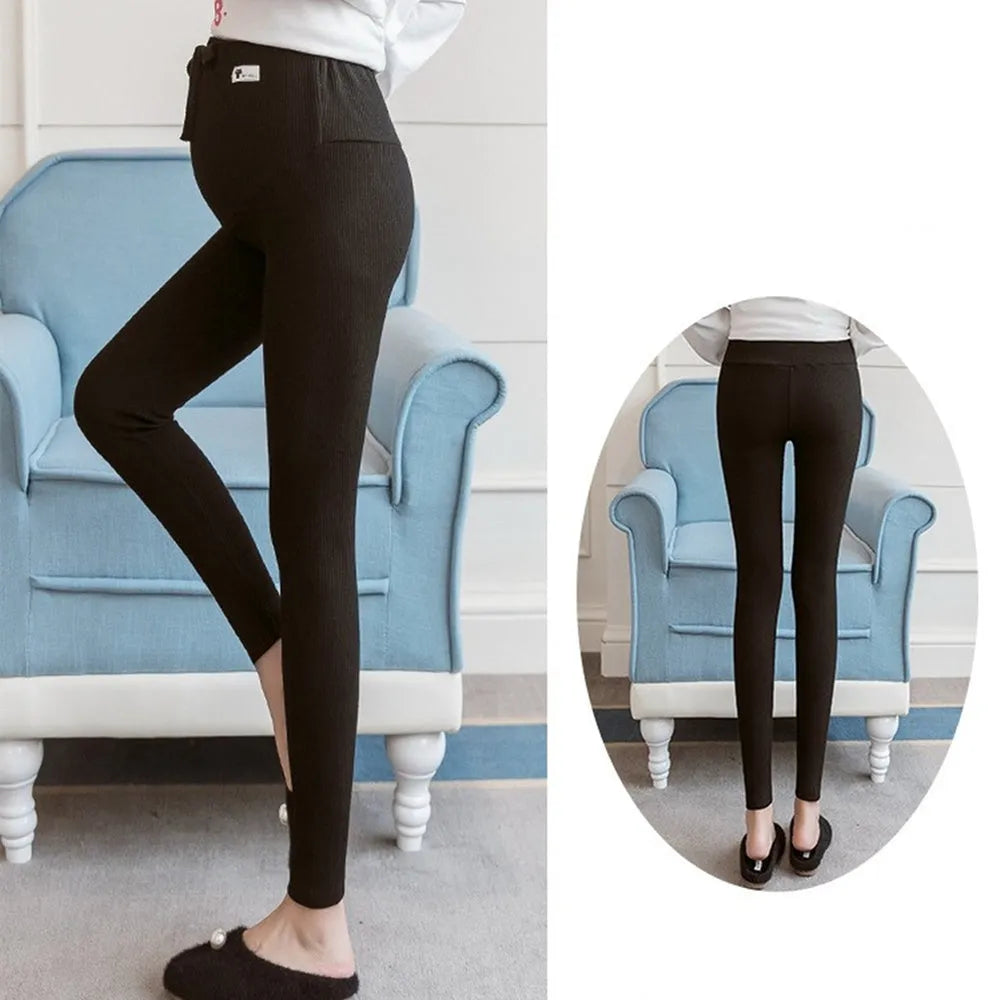 Black cotton maternity leggings with abdomen support, front view on model