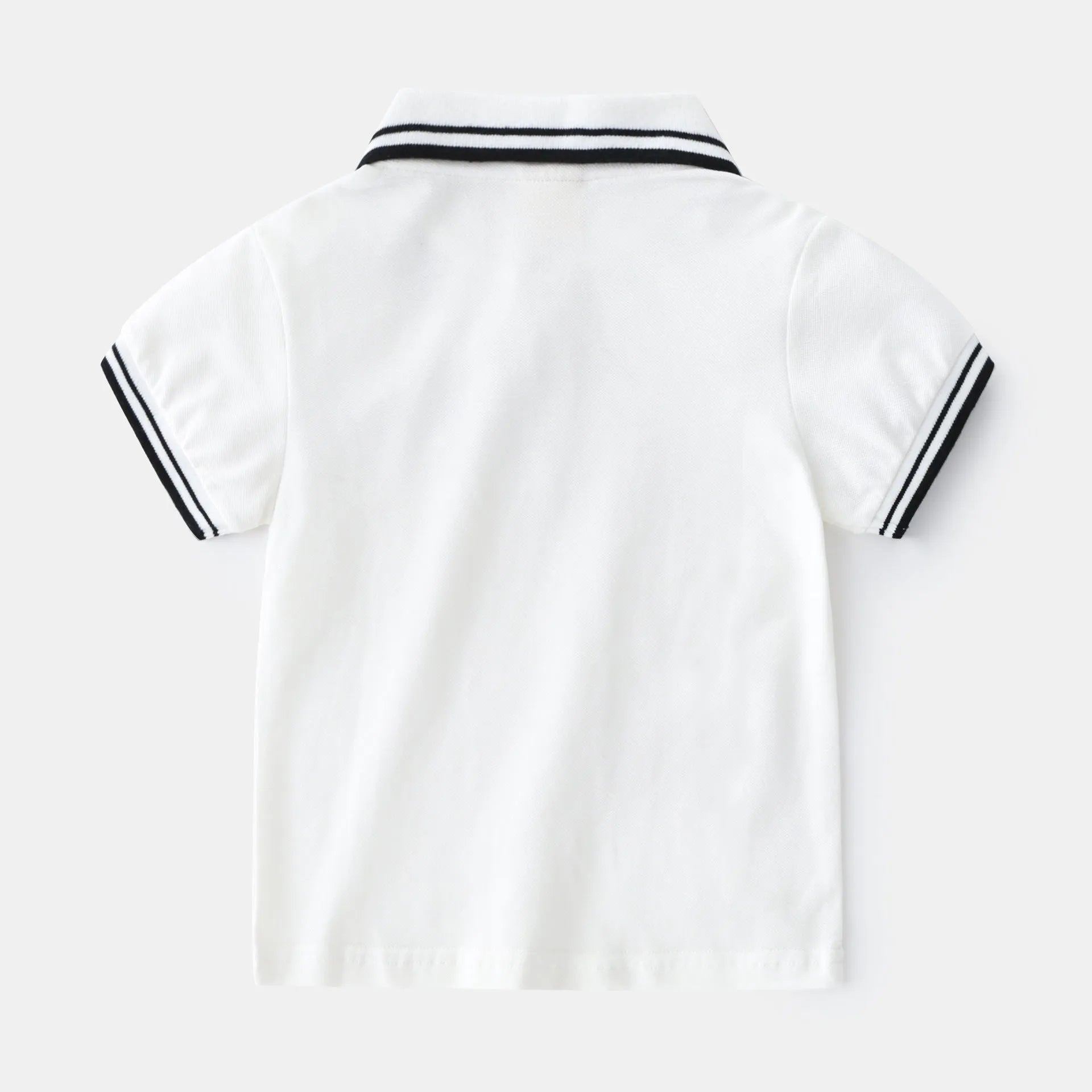 Boys' white cotton polo shirt with short sleeves and round neck on hanger
