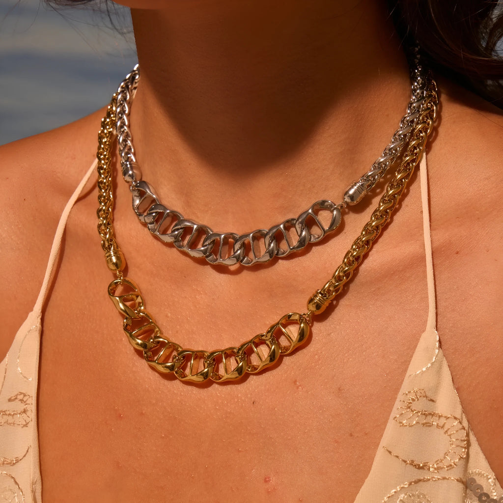 Women's gold-plated stainless steel necklace with geometric pendant design on regular chain