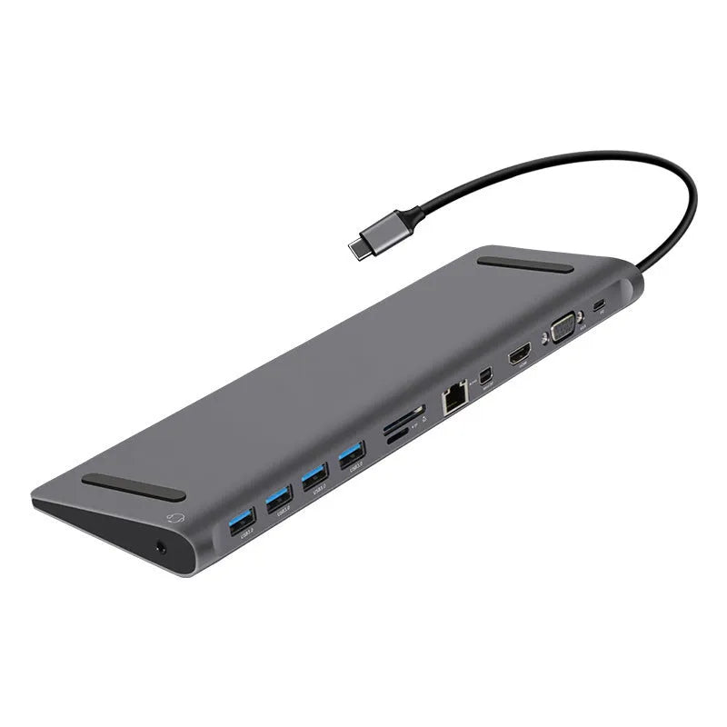 Grey aluminium alloy 12-in-1 Type-C hub with HDMI, VGA, USB 3.0, Ethernet, and PD ports on a desk