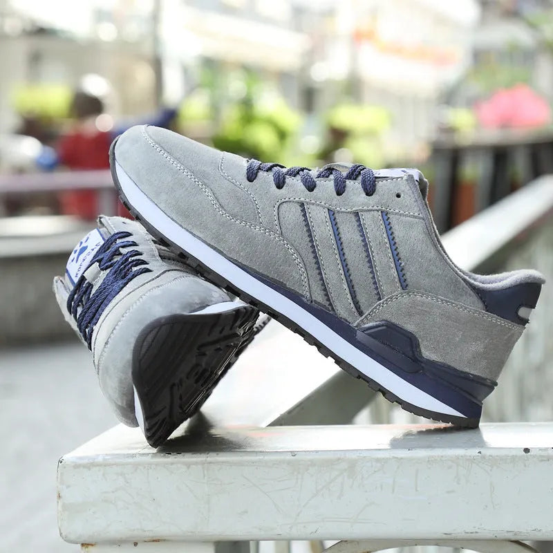 Blue leather sneakers for men with low-top design, pigskin upper, and rubber sole on a plain background