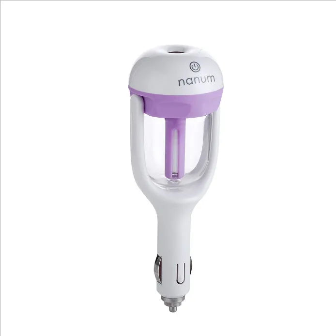 Compact blue car humidifier with rotating nozzle on car dashboard