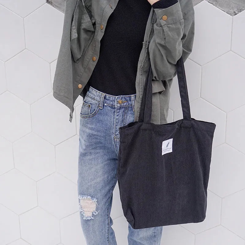 Women's corduroy shoulder bag in medium square vertical shape with soft handle, open top, available in black