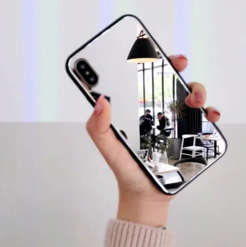Black iPhone case with a built-in rectangular mirror on the back cover, compatible with iPhone X, 7 Plus, 8 Plus, and 12 models.