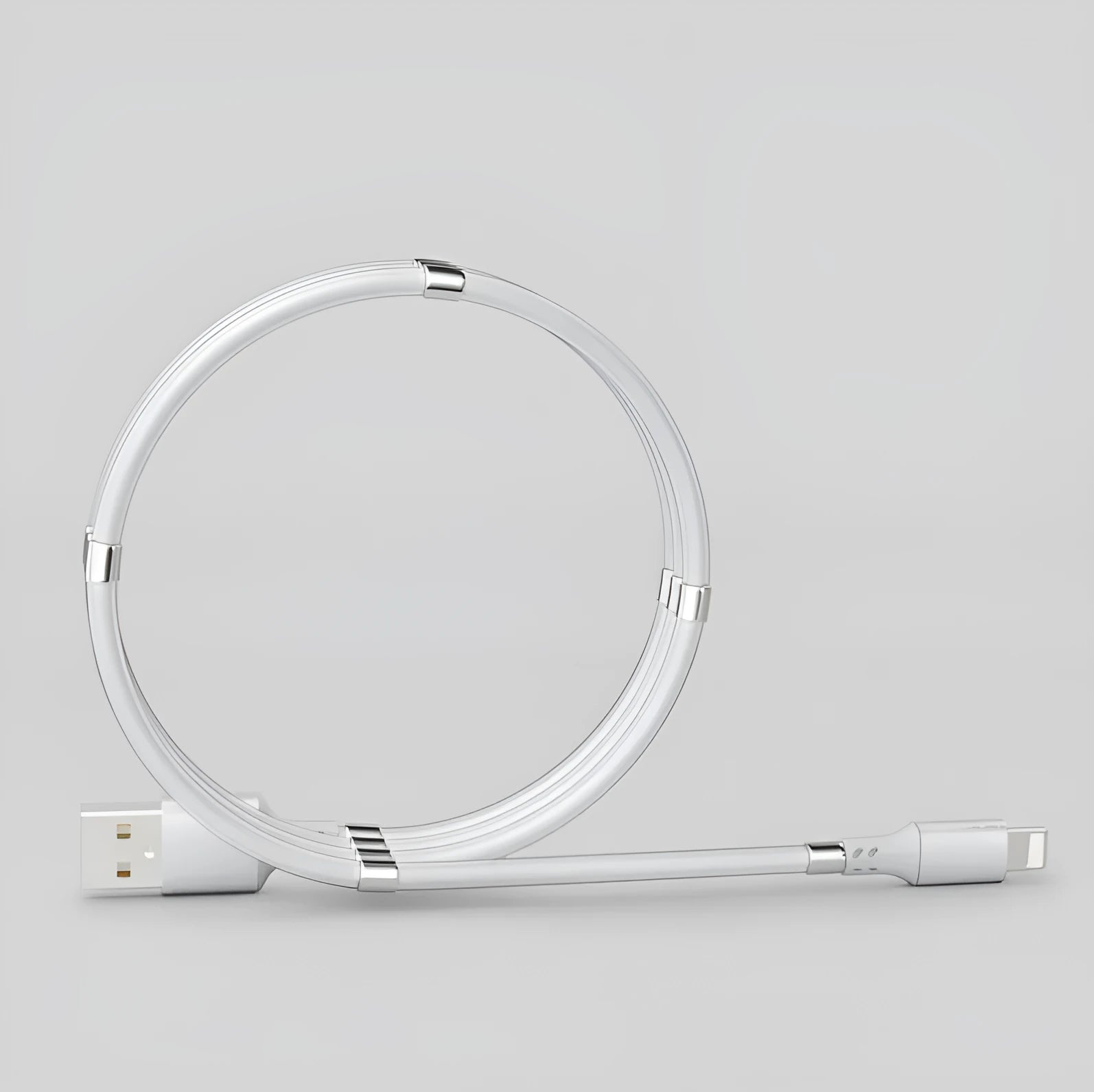 White magnetic nano data line with aluminium alloy joints and multiple connector heads on a desk