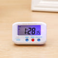 Portable LCD alarm clock with luminous display, showing time and date on screen