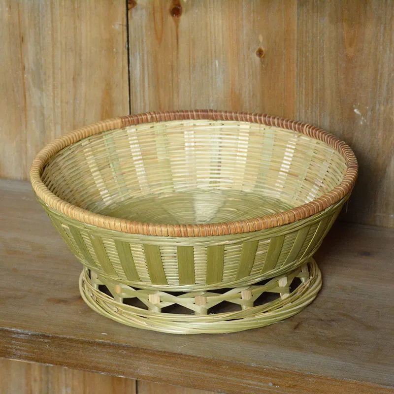 Three handmade bamboo storage baskets in different sizes including one with deepening design