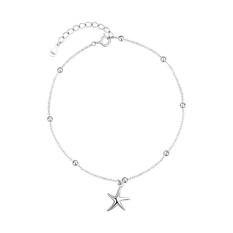 Silver starfish charm anklet on ankle showing S925 sterling silver construction and lobster clasp