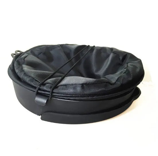 Black cylindrical foldable car trash bin 16x20.5cm with adjustable strap for vehicle cleaning and storage on a seat