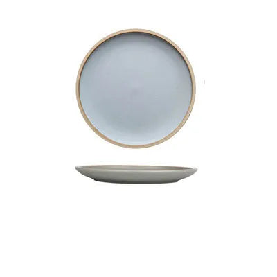 Blue matte ceramic dinner plate 10 inches with sesame point glaze on a table