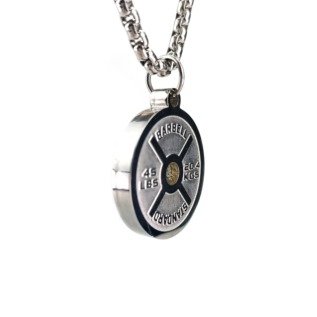 Polished stainless steel geometric barbell disk pendant on a choice of 60cm chains: black, gold, or pearl.