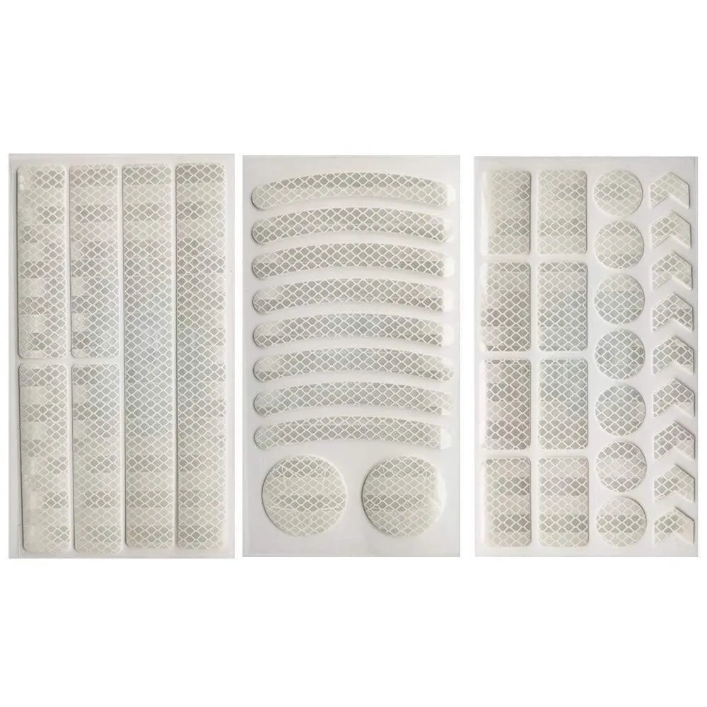 Reflective bicycle safety tape with a geometric grid pattern, shown in red, yellow, blue, and white colours.