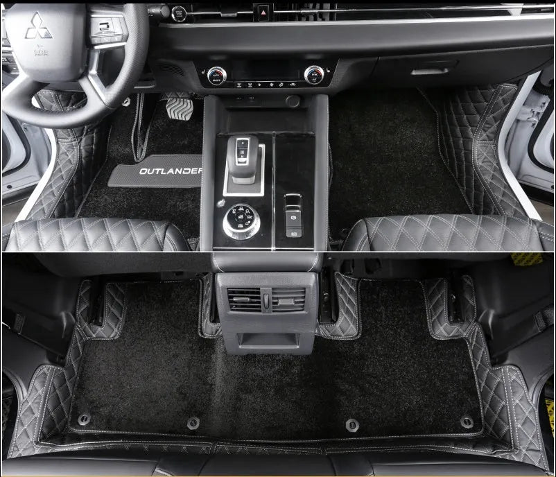 Custom black PU floor mats installed in a Mitsubishi Outlander footwell.