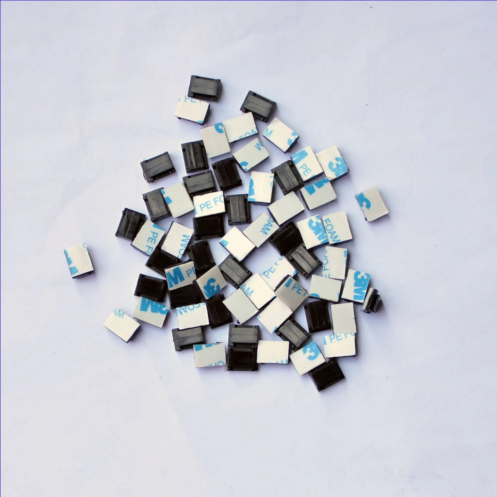 Black PA66 plastic automotive wire retaining clips for cable management in cars.