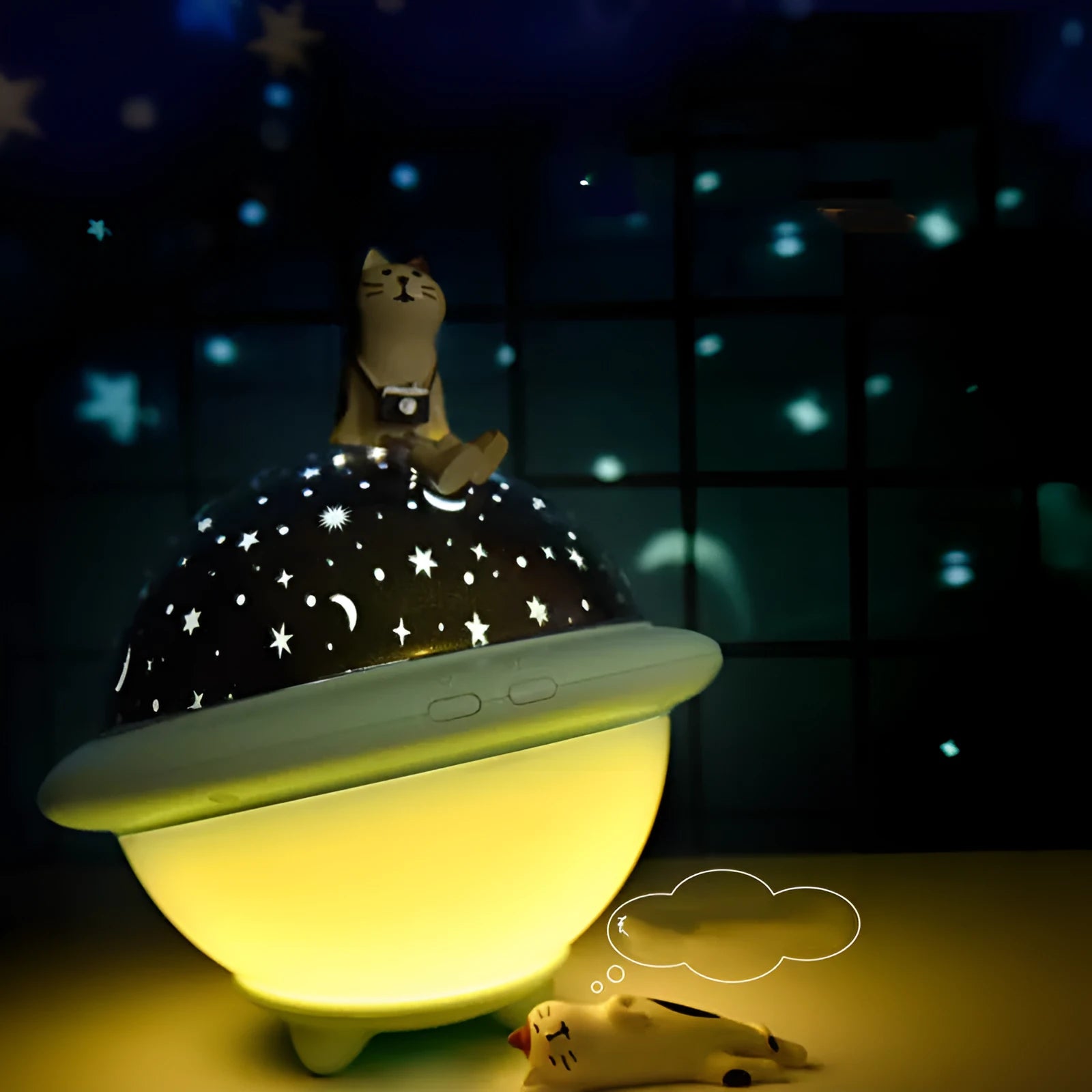Pink UFO-shaped LED night light projecting a starry sky pattern on a wall.