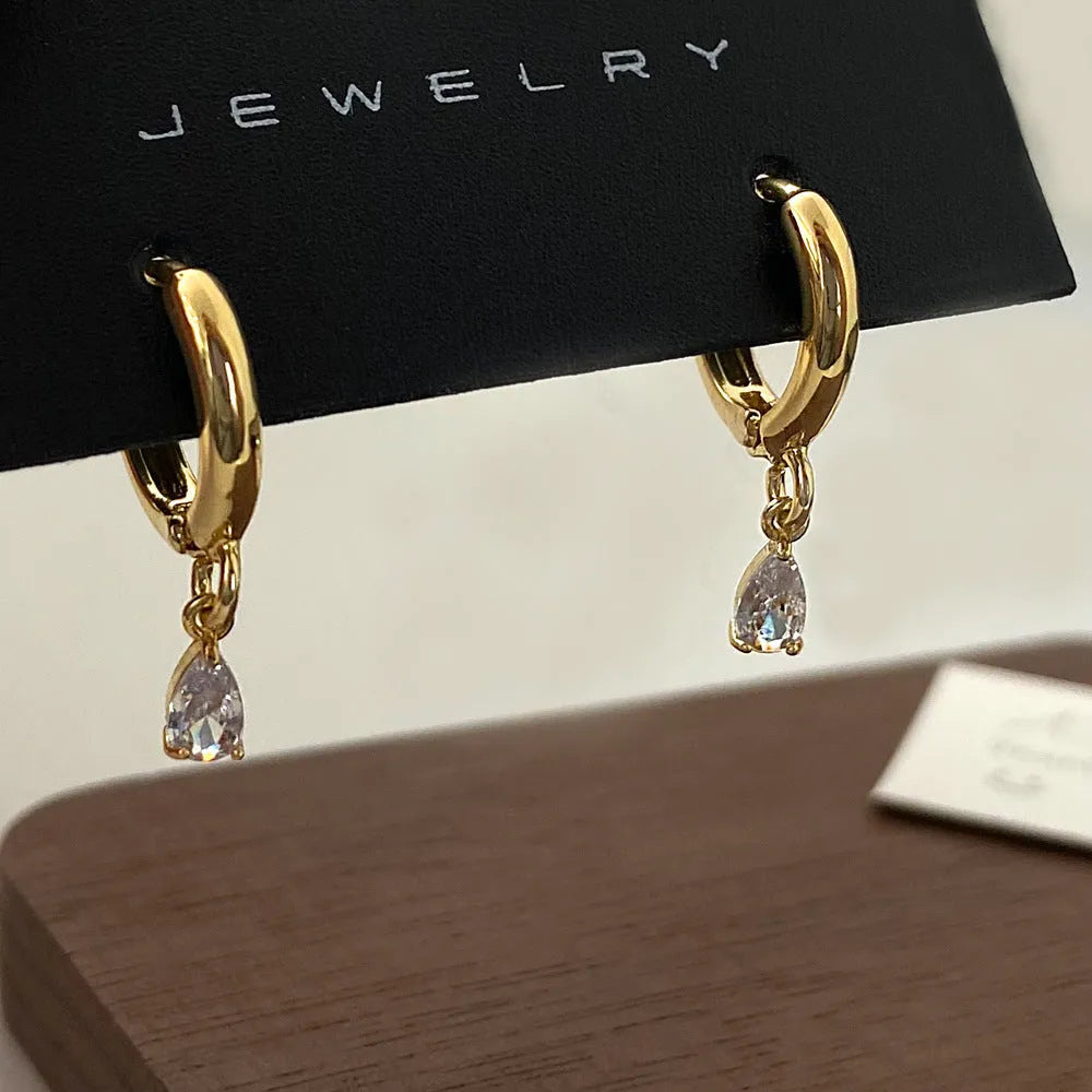 Zircon necklace, earrings, and anklet set with geometric meteor shower design on a regular chain.