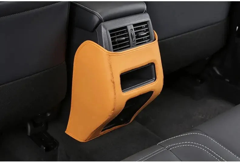 Set of three black leather anti-kick pads for Mitsubishi Outlander rear seats