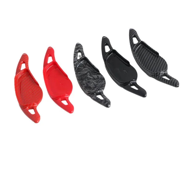 Carbon fibre pattern steering wheel paddle shifters in black and red finishes