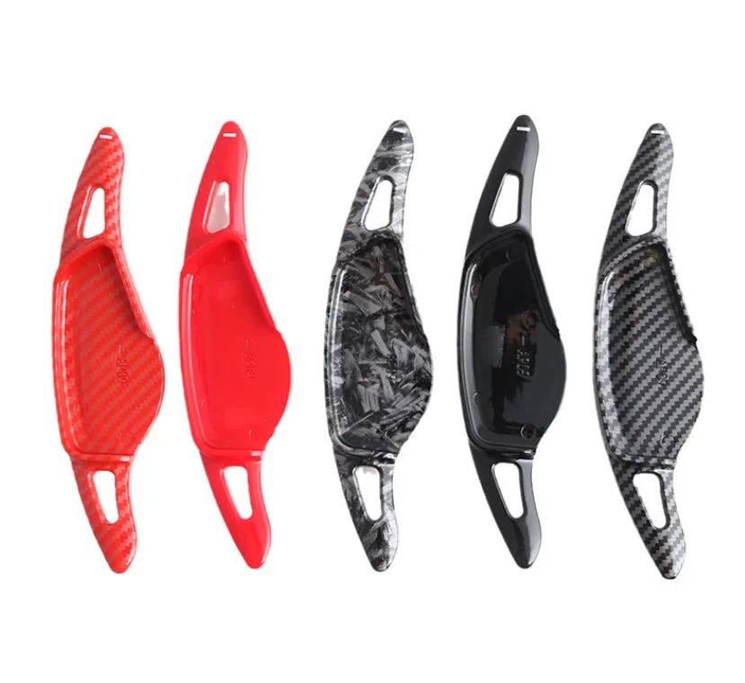 Carbon fibre pattern steering wheel paddle shifters in black and red finishes